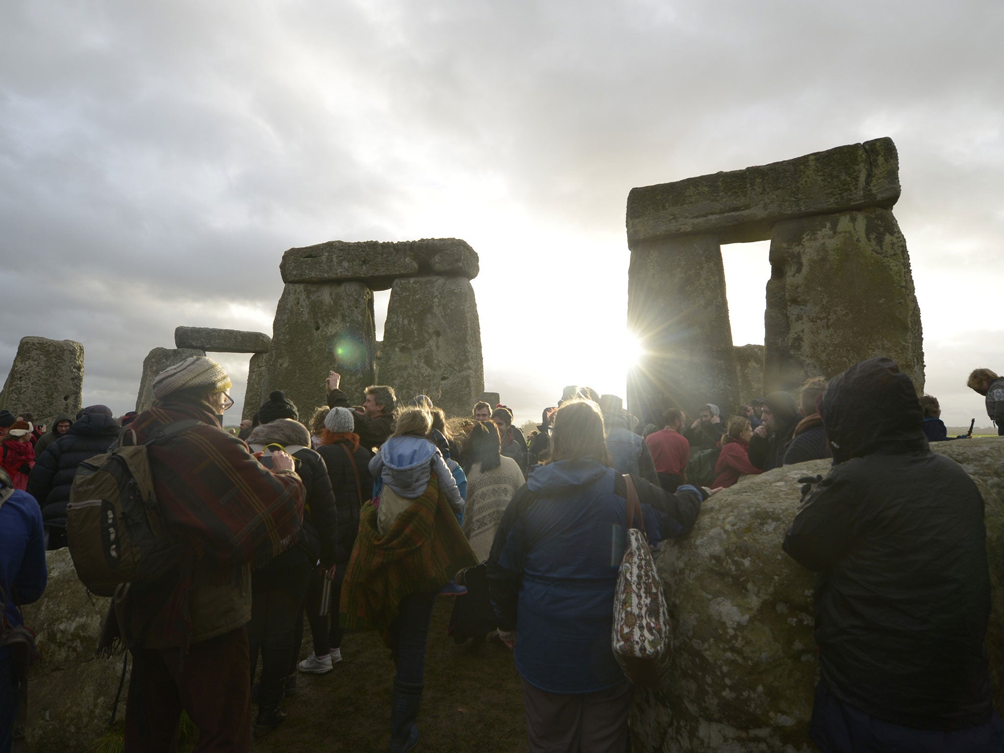 People gather at Stonehenge in Wiltshire on the Winter Solstice to witness the sunrise on the shortest day of the year