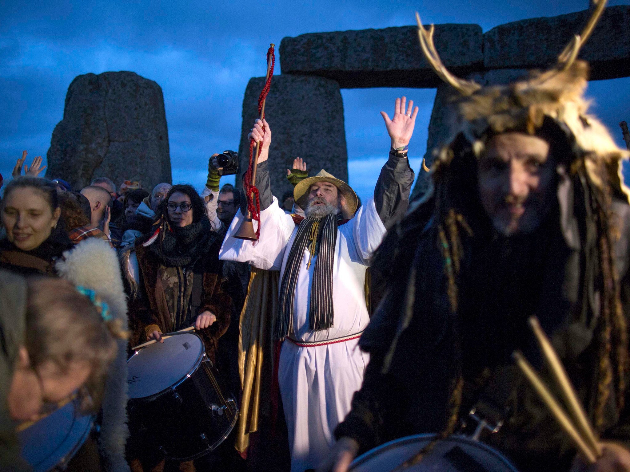 Revellers celebrate the winter solstice at Stonehenge on Salisbury Plain in southern England