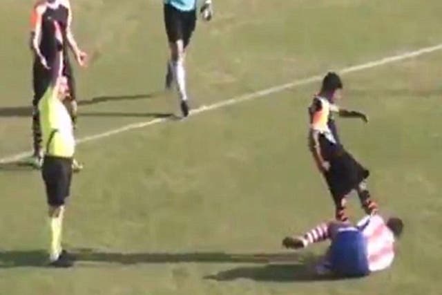 Sanayispor player Mehmet Degirmenci kicks Kayhan Karakas of Dallicaspor in the head