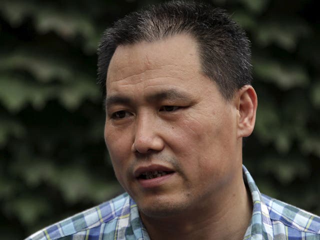 Chinese human rights lawyer Pu Zhiqiang talks to the media in Beijing in this July 20, 2012