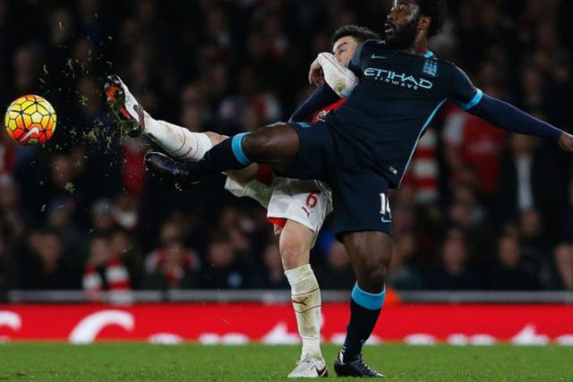 Wilfried Bony vies with Arsenal defender Laurent Koscielny in Monday night's defeat