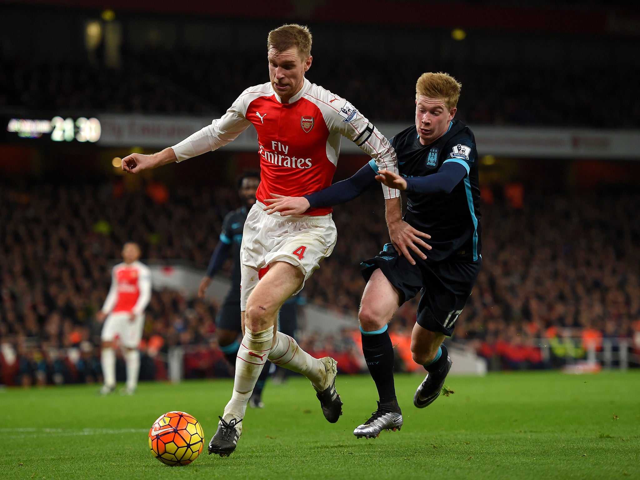 Per Mertesacker (left) had a cracking game at the Emirates on Monday night