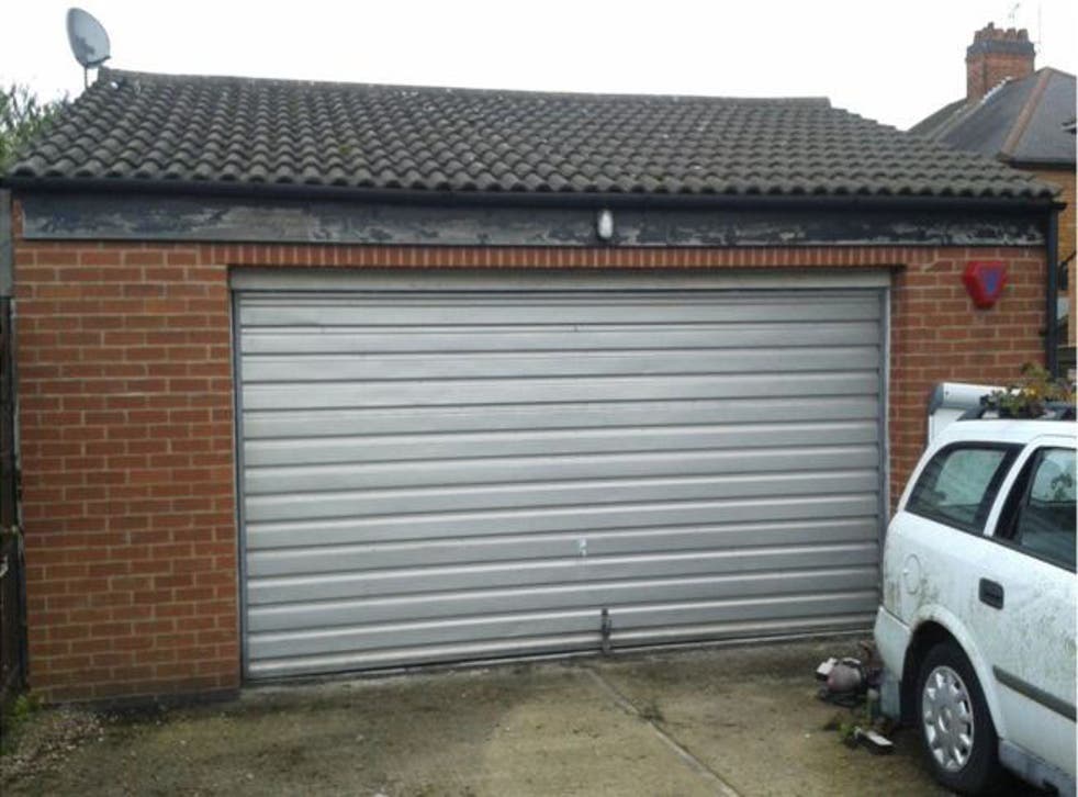 The detached double garage where a Portuguese family of three were found to be living