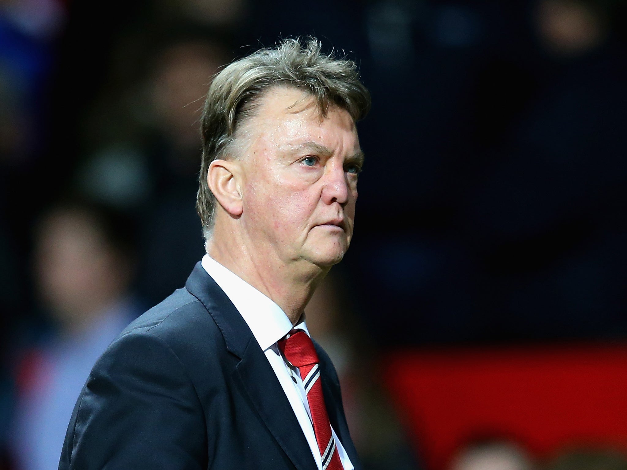A downbeat Louis van Gaal looks on from the touchline