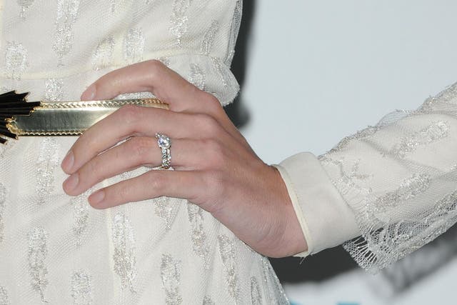 The would-be bride is said to have put her hand over her mouth and walked away when she saw the ring (file image)