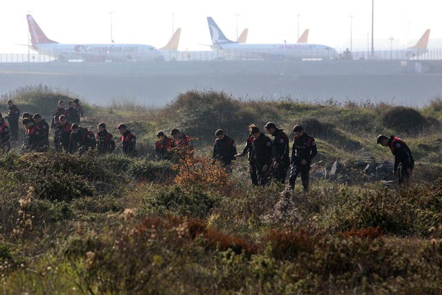 Turkish police search around Sabiha Gokcen Airport after an explosion left one dead and extensive damage to planes on 23 Decenber 2015.