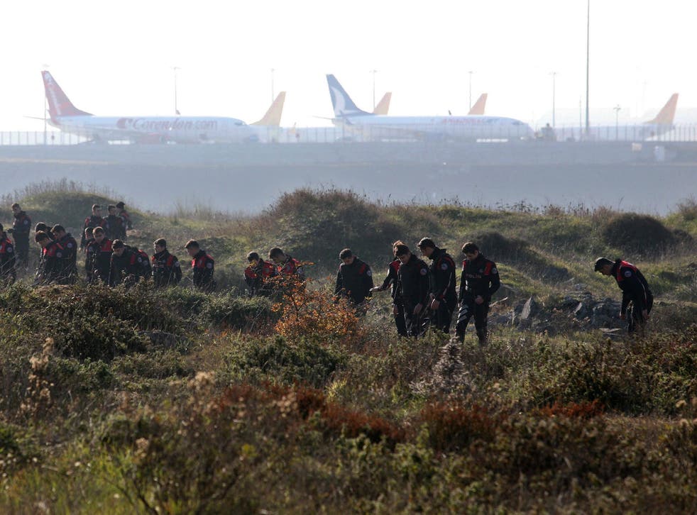 Turkish police search around Sabiha Gokcen Airport after an explosion left one dead and extensive damage to planes on 23 Decenber 2015.