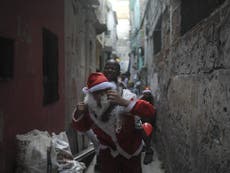 Santa Claus delivers Christmas presents to Rio de Janerio favela