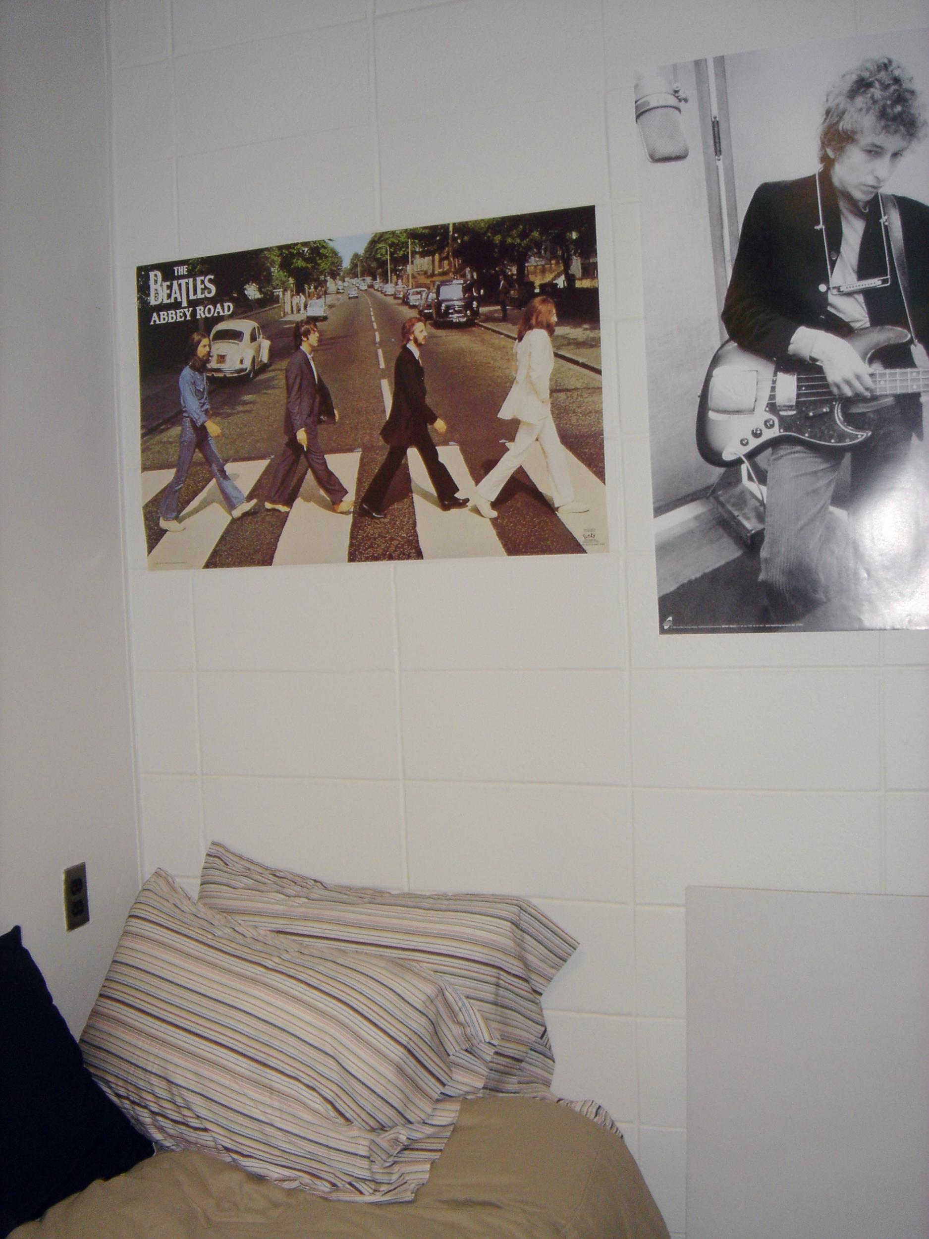 Posters on the wall in a dorm room