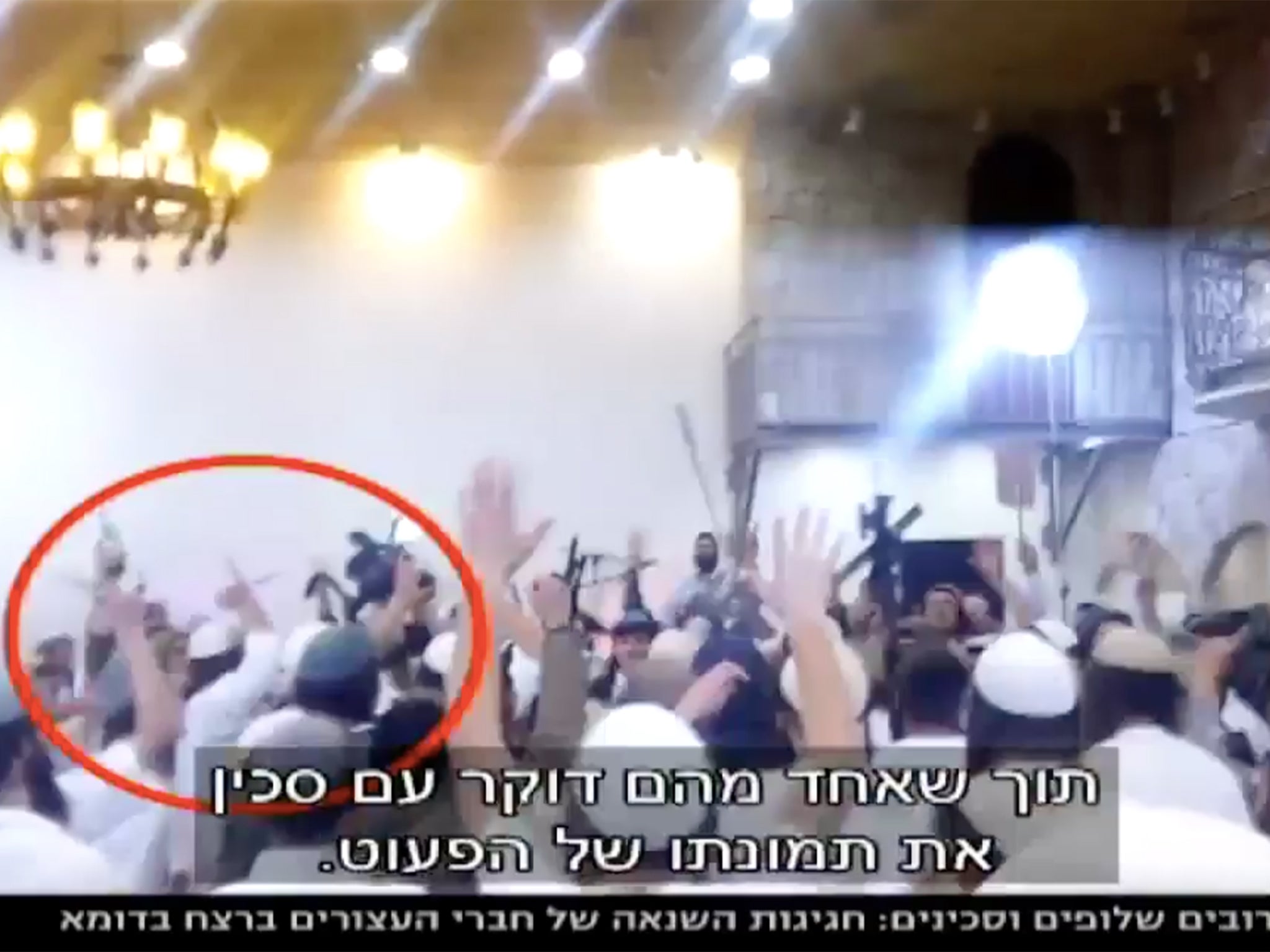 The video was shown on Israeli TV channel News 10 and showed wedding guests dancing with guns and knives