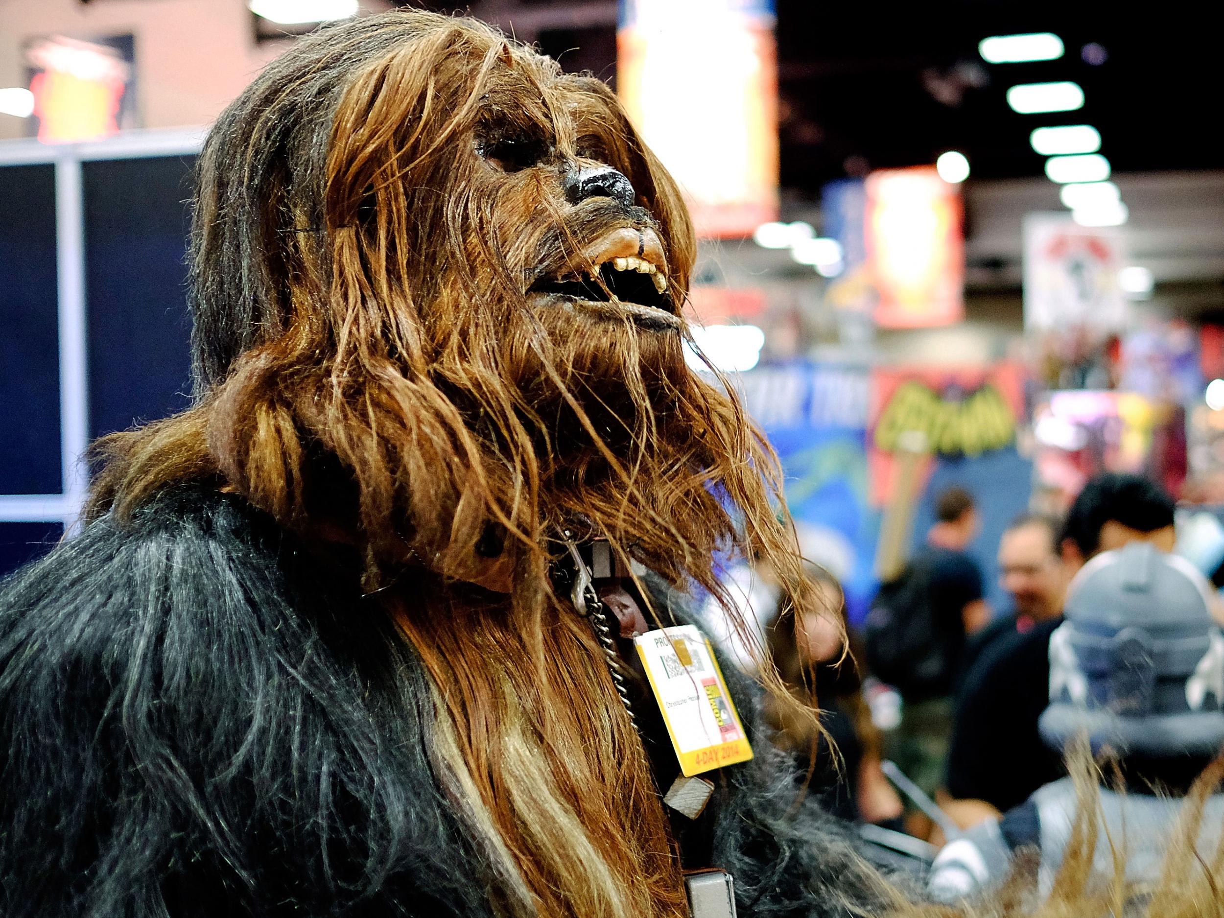 Christopher Petrone, of San Diego, CA, towering over attendees in his handmade, to-scale Chewbacca costume, during the 45th annual San Diego Comic-Con