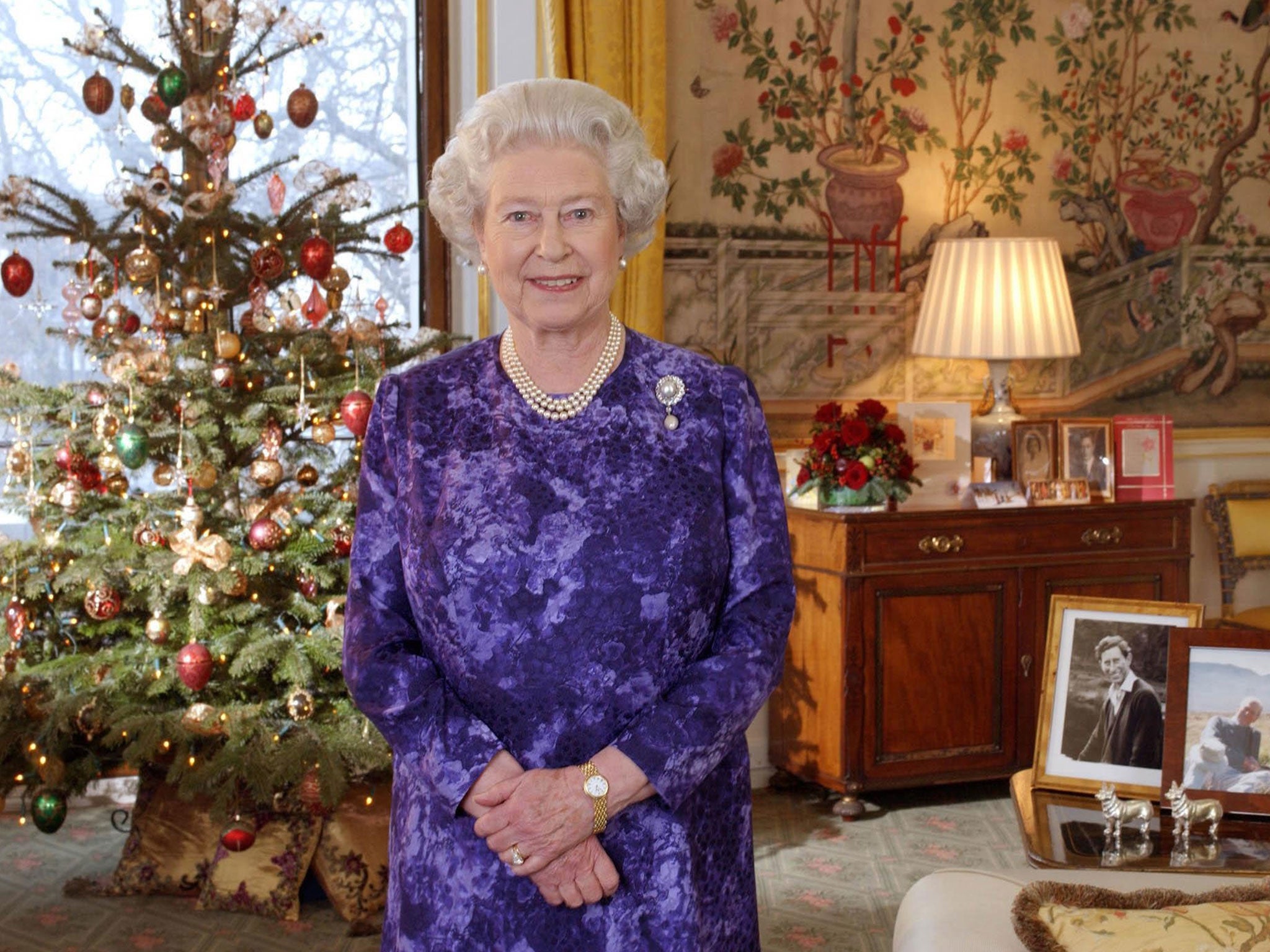 Queen Elizabeth II records her Christmas Day message in the Yellow Drawing Room at Buckingham Palace on 24 December, 2004 in London