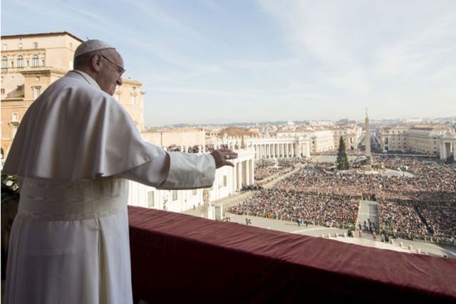 Pope Francis delivers his "Urbi et Orbi" (to the city and to the world) blessing from the central balcony of St. Peter's Basilica at the Vatican