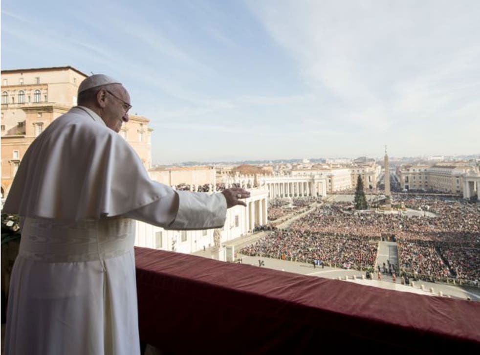 Pope Francis delivers his "Urbi et Orbi" (to the city and to the world) blessing from the central balcony of St. Peter's Basilica at the Vatican