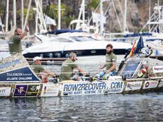 Veterans rowing the Atlantic celebrate Christmas with tinned fruit