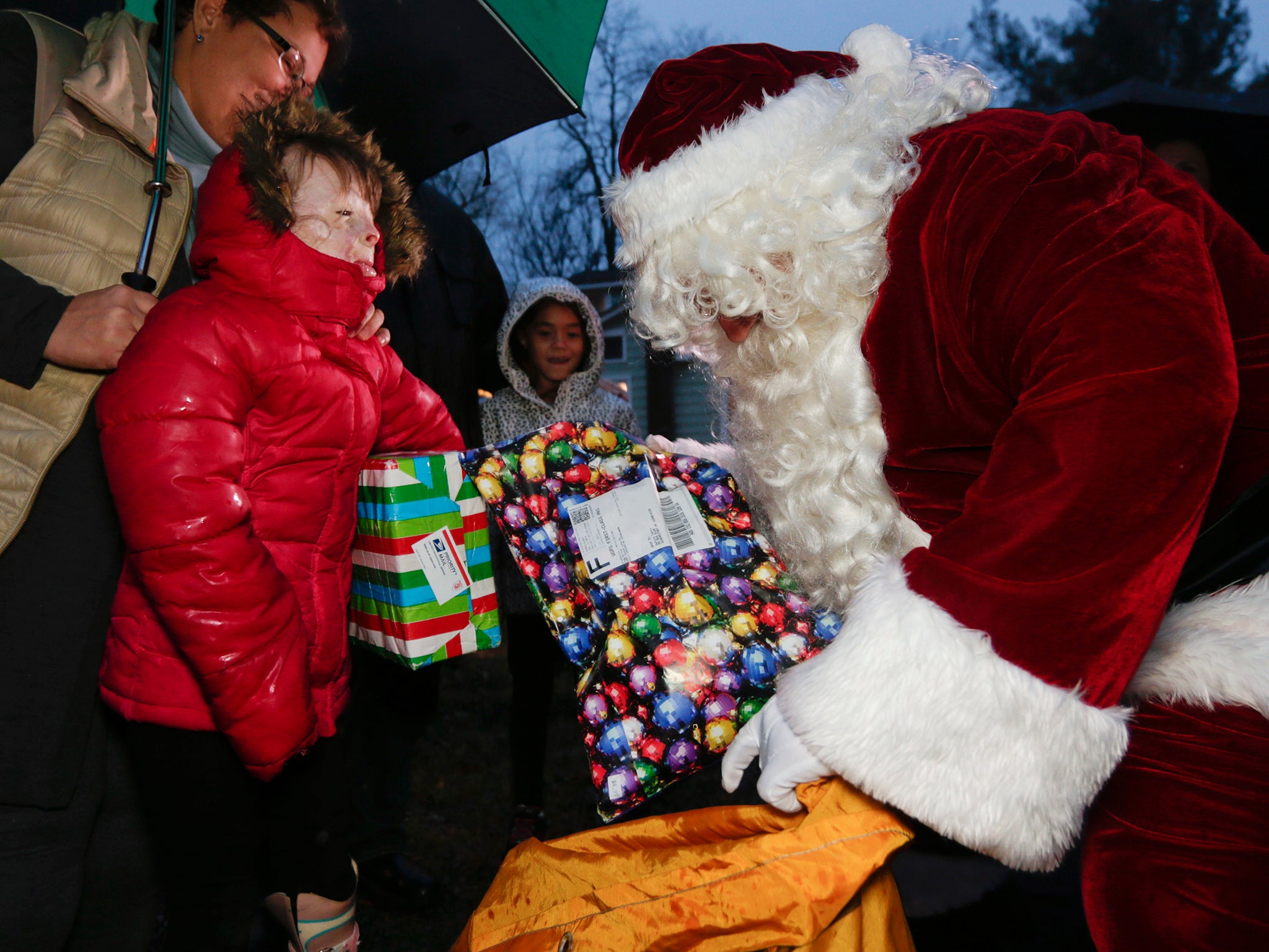 Safyre Terry receives packages from Santa Claus in Rotterdam, N.Y