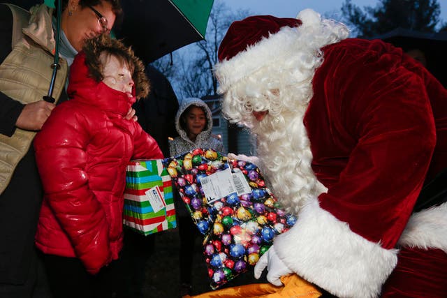 Safyre Terry receives packages from Santa Claus in Rotterdam, N.Y