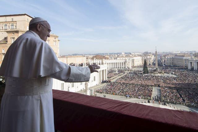 Pope Francis  waves to pilgrims in St Peter’s Square