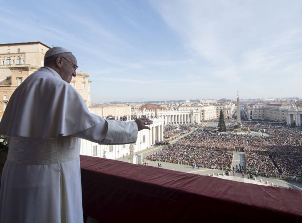 Pope Francis  waves to pilgrims in St Peter’s Square