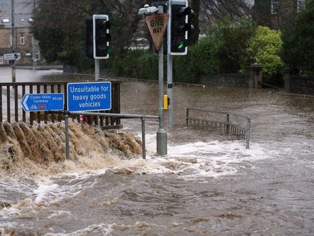 The River Calder bursts its bank's in the Calder Valley town of Mytholmroyd