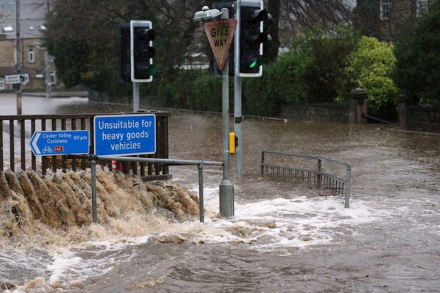 The River Calder bursts its bank's in the Calder Valley town of Mytholmroyd