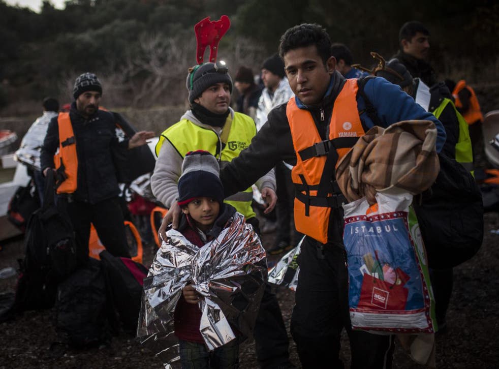 Refugees arrive on the Greek island of Lesvos on Christmas Eve