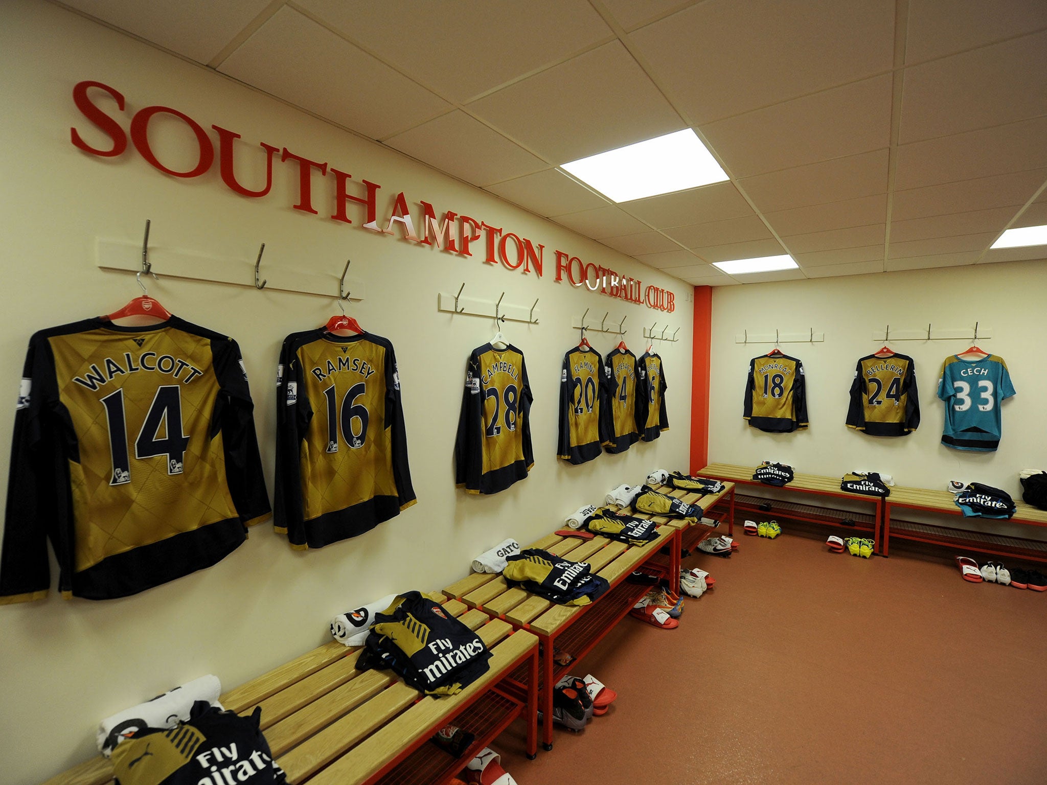 The Arsenal starting line-up shirts are hung up in the changing room at St Mary's