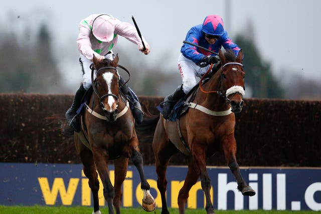 Cue Card (right) battles with Vautour (left) in the home stretch of the King George VI Chase