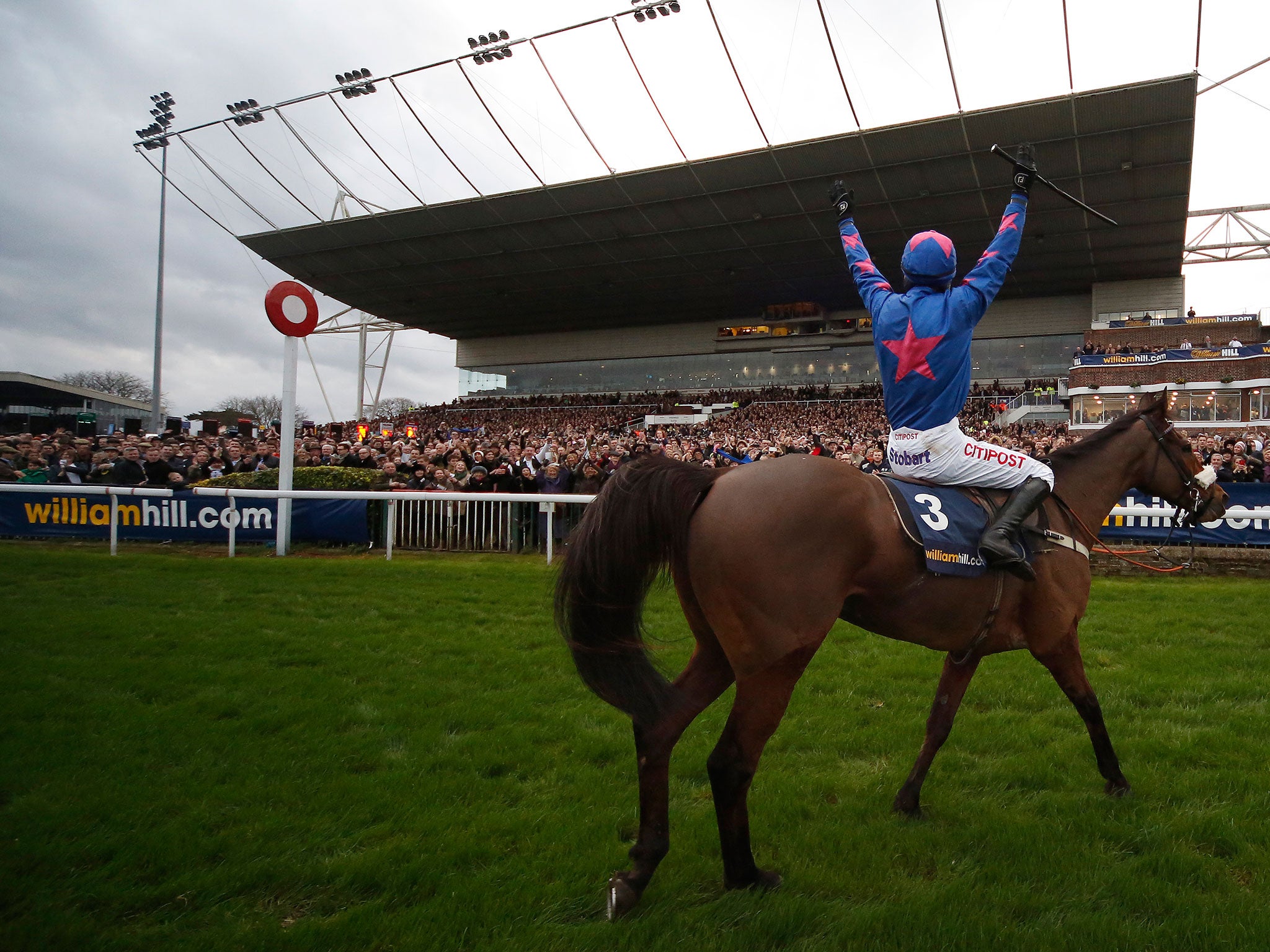 Paddy Brennan salutes the Kempton crowd after winning the King George VI Chase on Cue Card