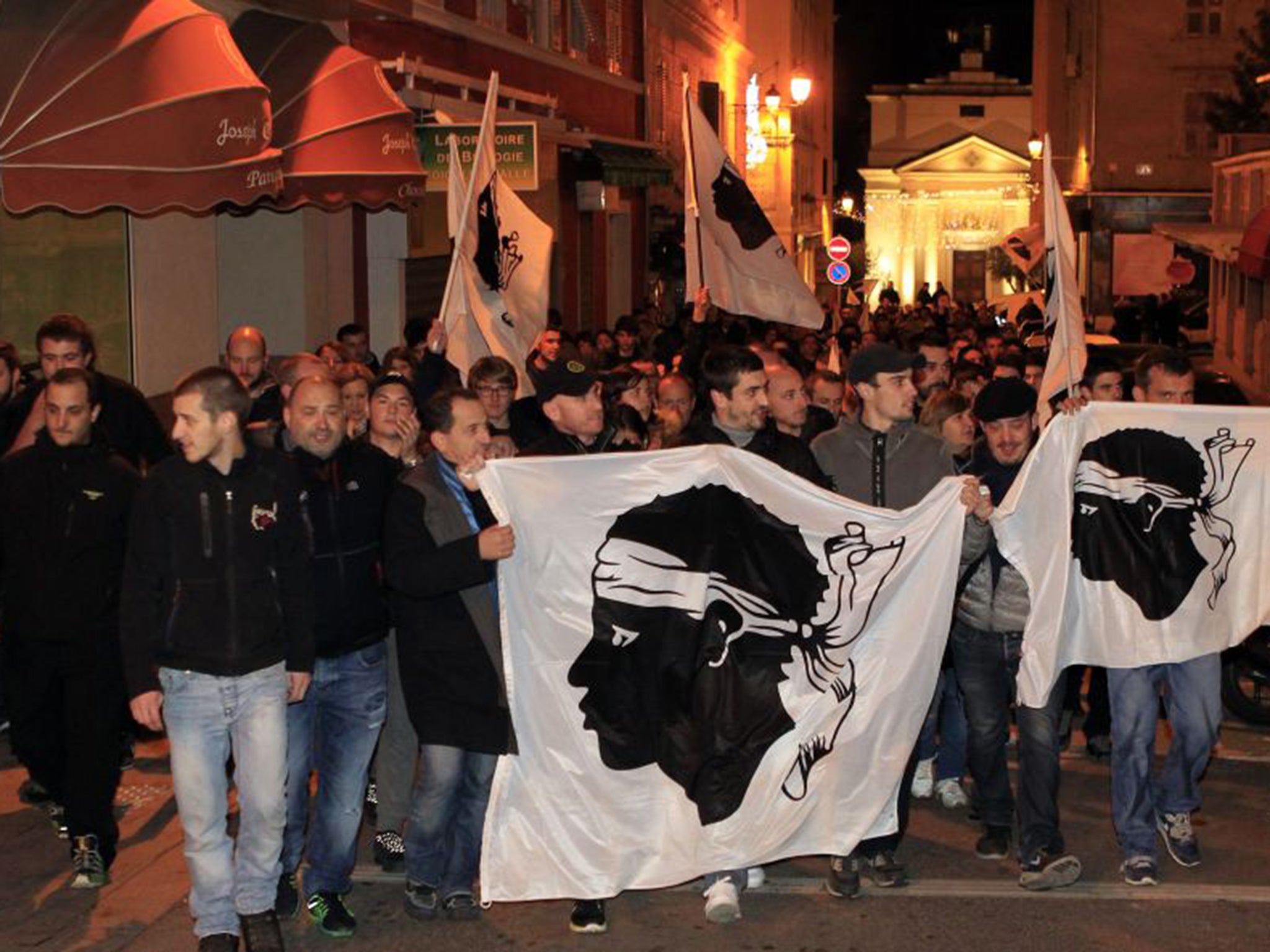 Nationalist protesters with the moor’s head flag