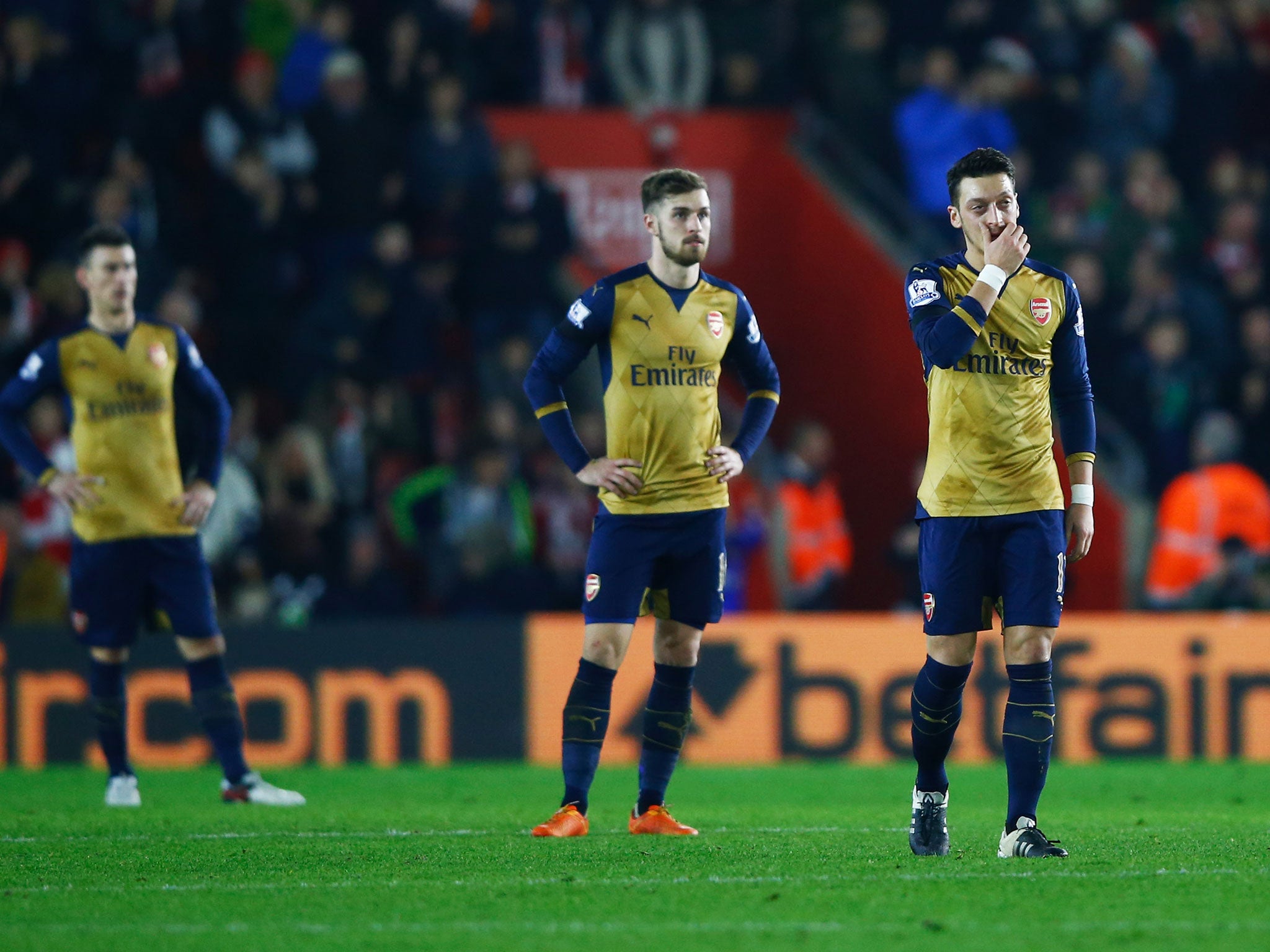 Arsenal players react after losing to Southampton 4-0 on Boxing Day