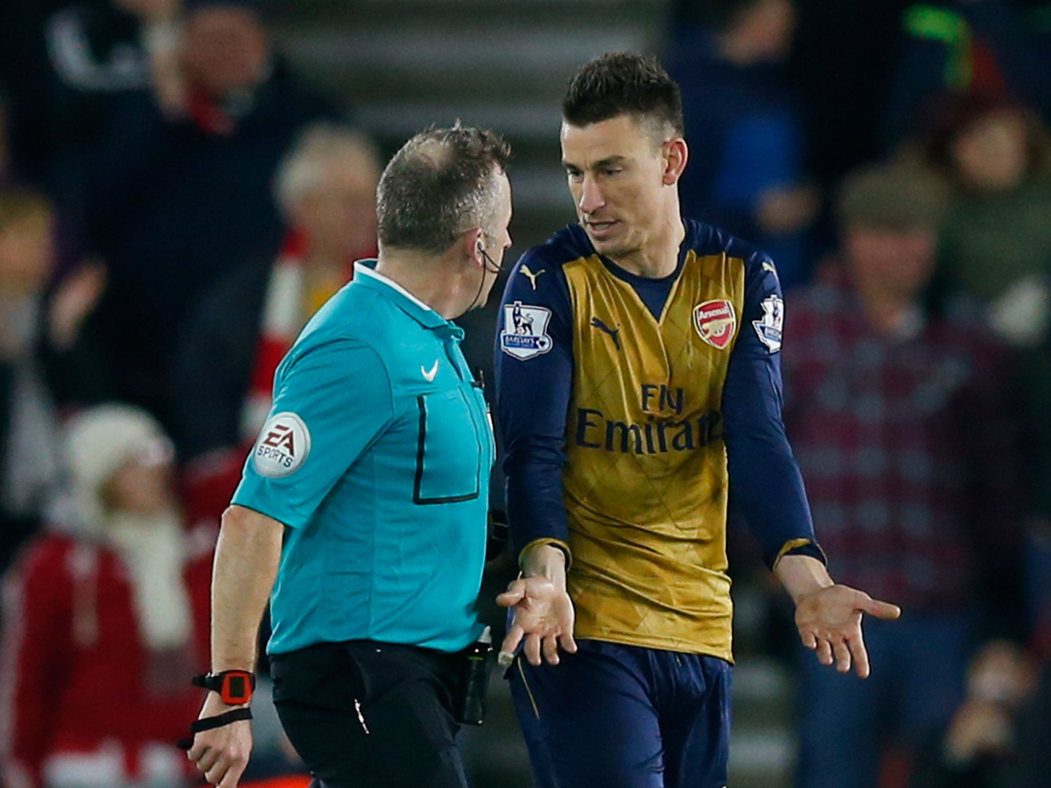 Laurent Koscielny protests after being tripped by Shane Long in the build up to Southampton's second goal