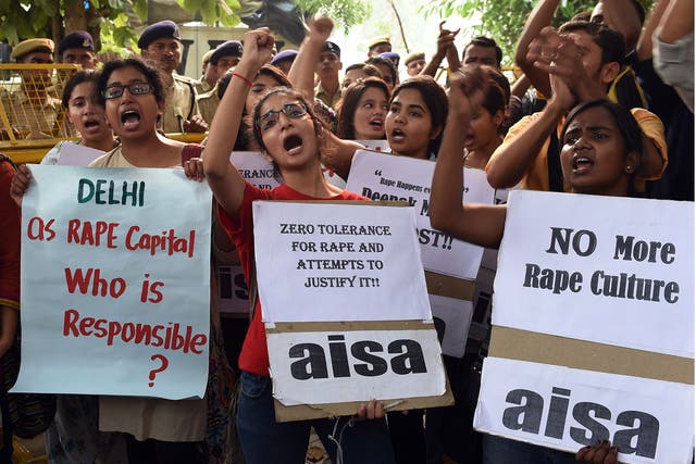 Indian students protest against the rapes of two minor girls outside the police headquarters in New Delhi in October 