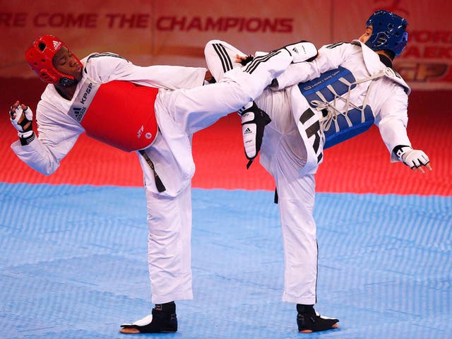 Lutalo Massop Muhammad (red) of Great Britain and Mehdi Khodabakhshi (blue) of Iran compete in the World Taekwondo Grand Prix