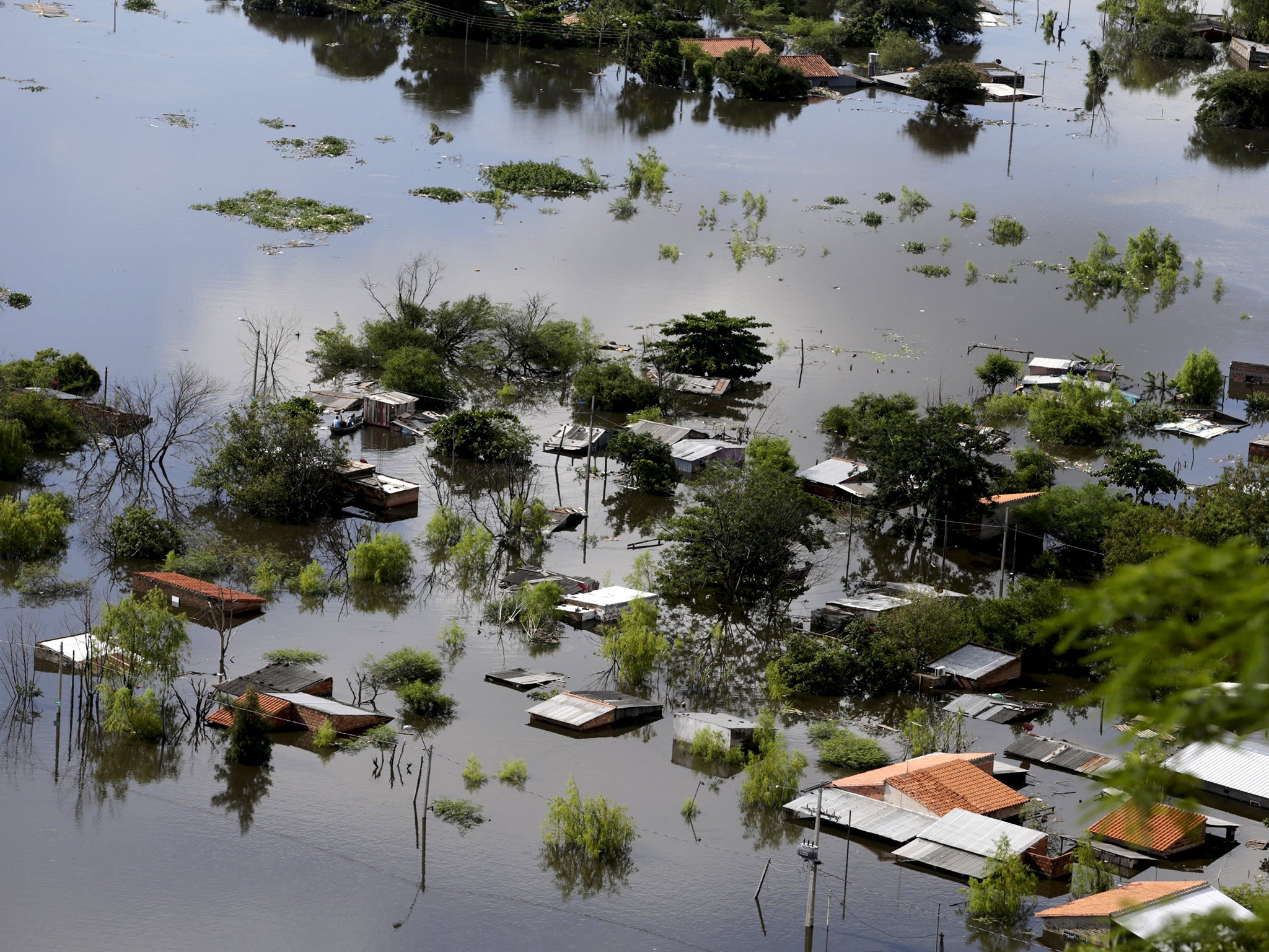 Houses are partially submerged in floodwaters in Asuncion, Paraguay