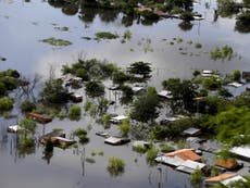 Flooding forces more than 100,000 to flee their homes in South America