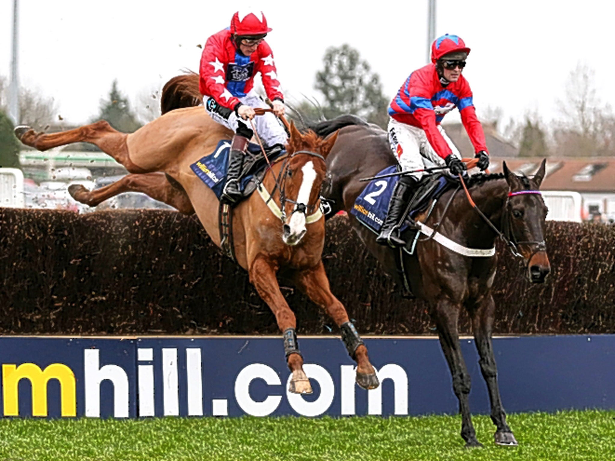 Sprinter Sacre (right), partnered by Nico de Boinville, gets the better of Sire De Grugy and Jamie Moore in the Desert Orchid Chase at Kempton