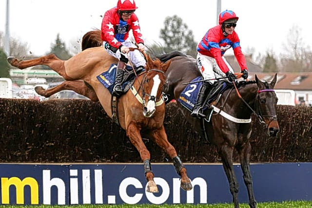 Sprinter Sacre (right), partnered by Nico de Boinville, gets the better of Sire De Grugy and Jamie Moore in the Desert Orchid Chase at Kempton