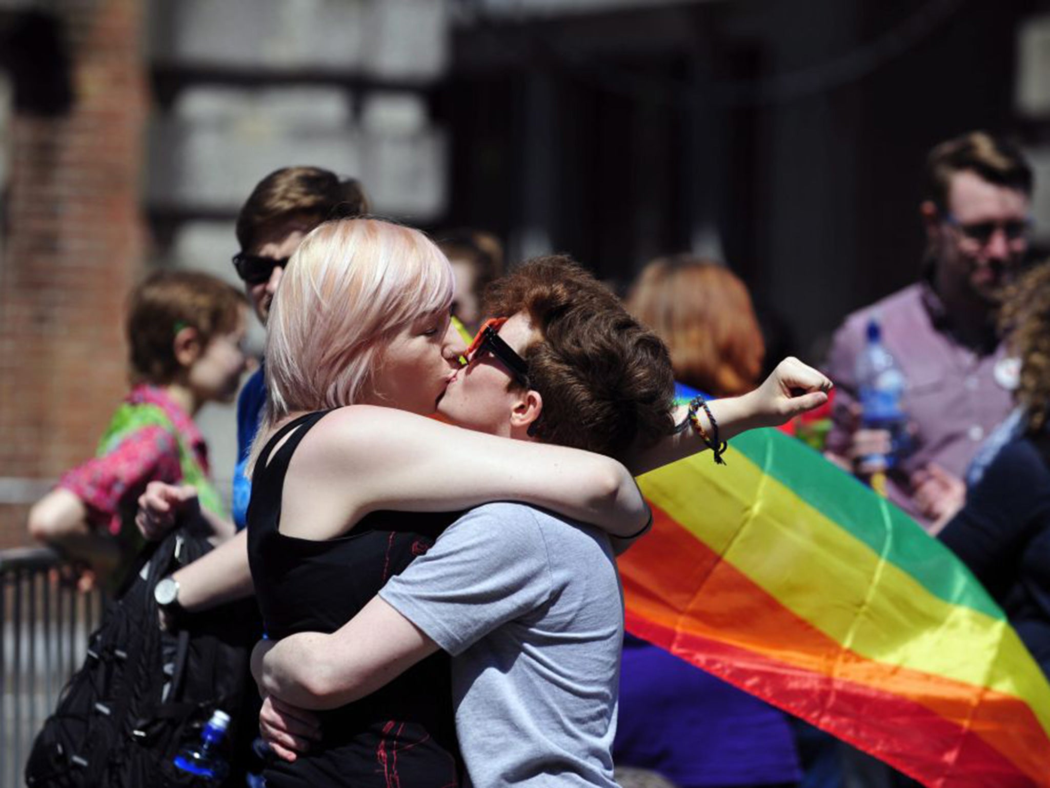 A couple kiss after early results suggest an overwhelming majority in favour of the referendum on same-sex marriage, in Dublin, Ireland, 23 May 2015
