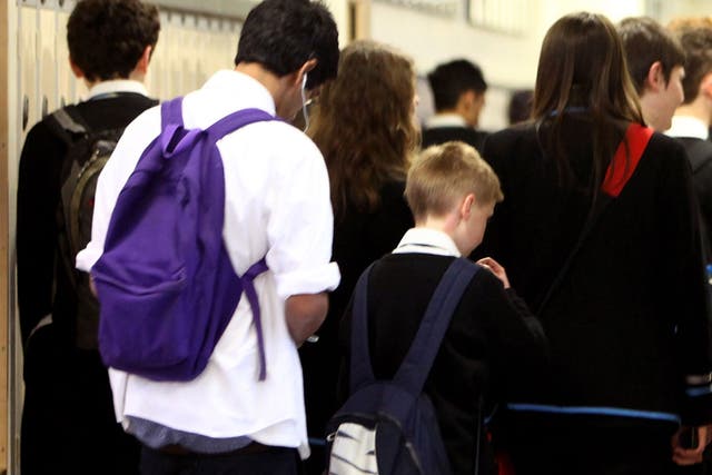 Pupils at Williamwood High School make their way to classes
