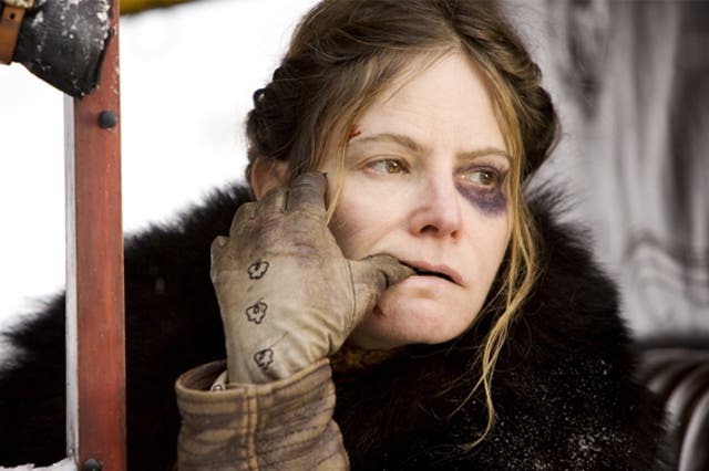 Jennifer Jason Leigh's character Daisy is repeatedly beaten up by Russell's bounty hunter Ruth