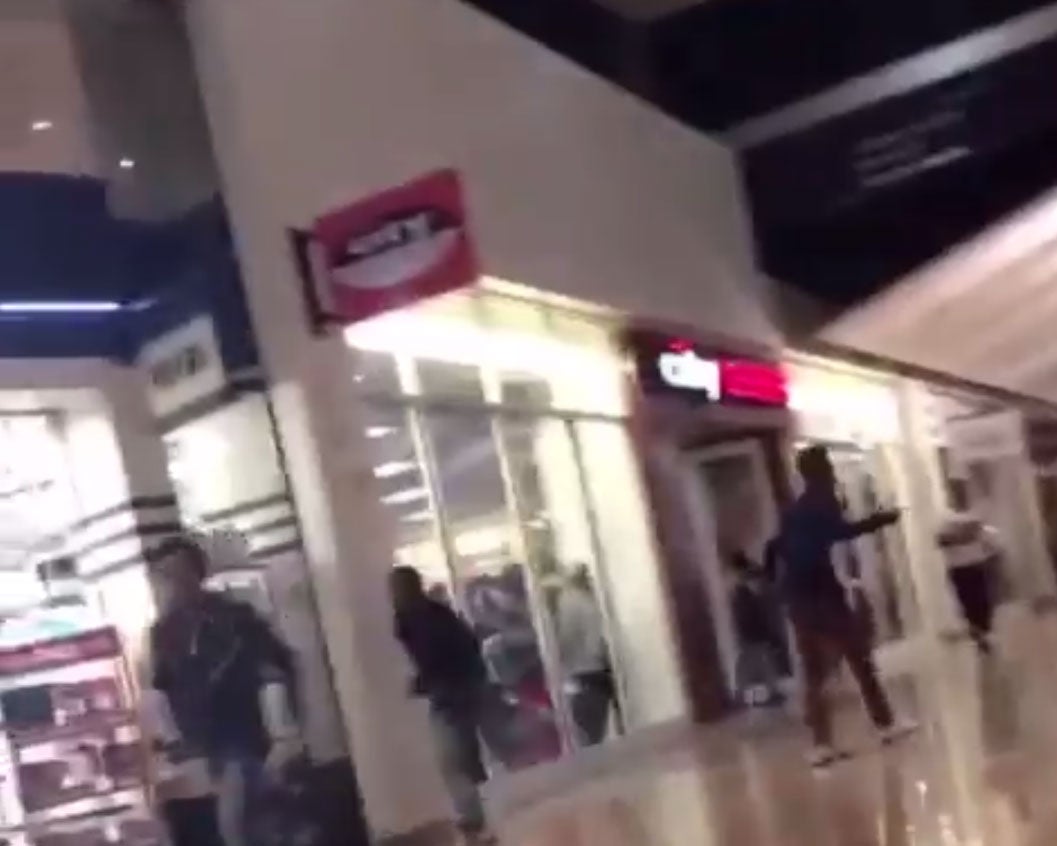 Teens running from a brawl in Mall St. Matthews, Kentucky