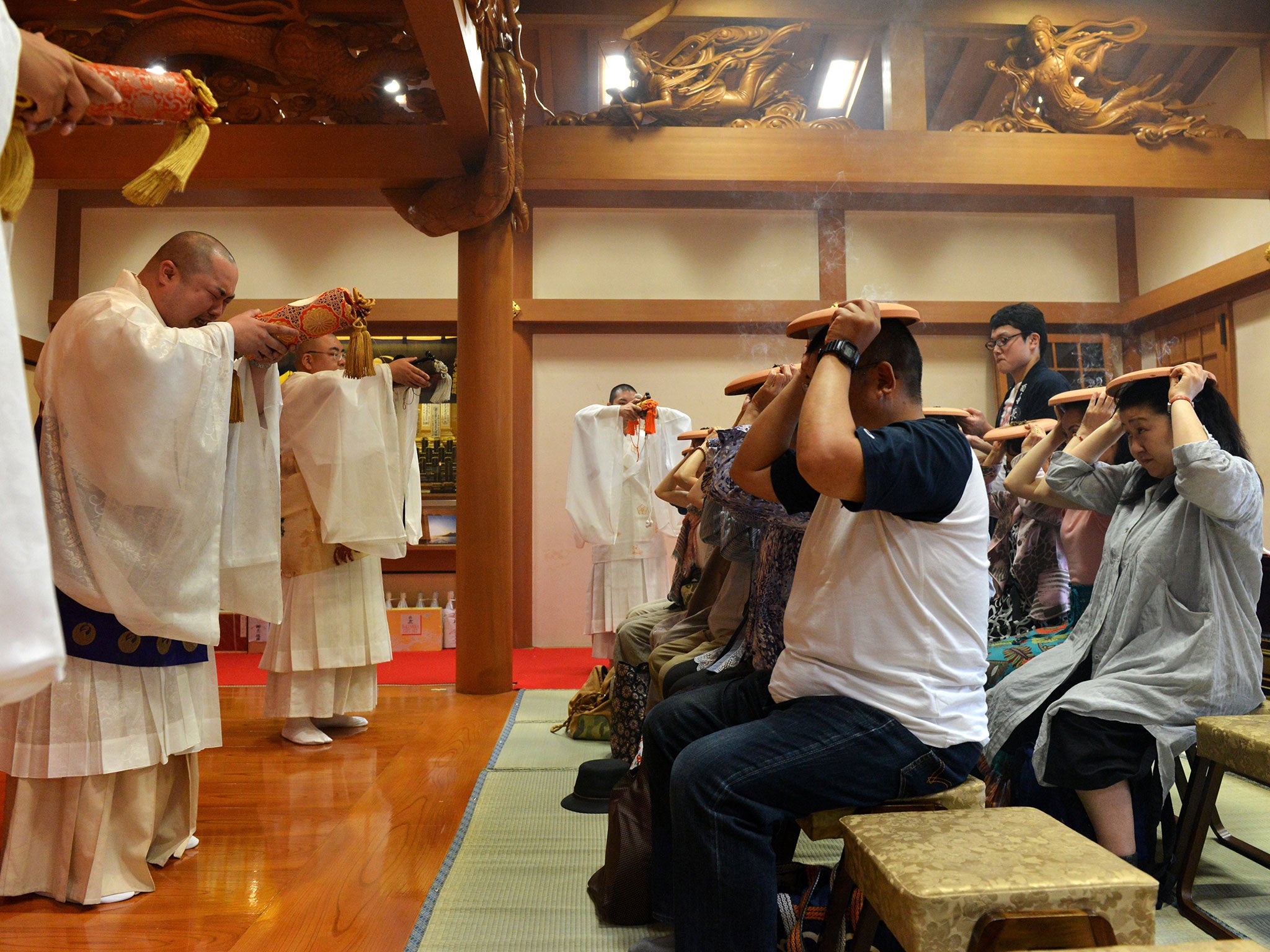 Buddhists at Tokyo's Chokoku-ji temple on June 21, 2015