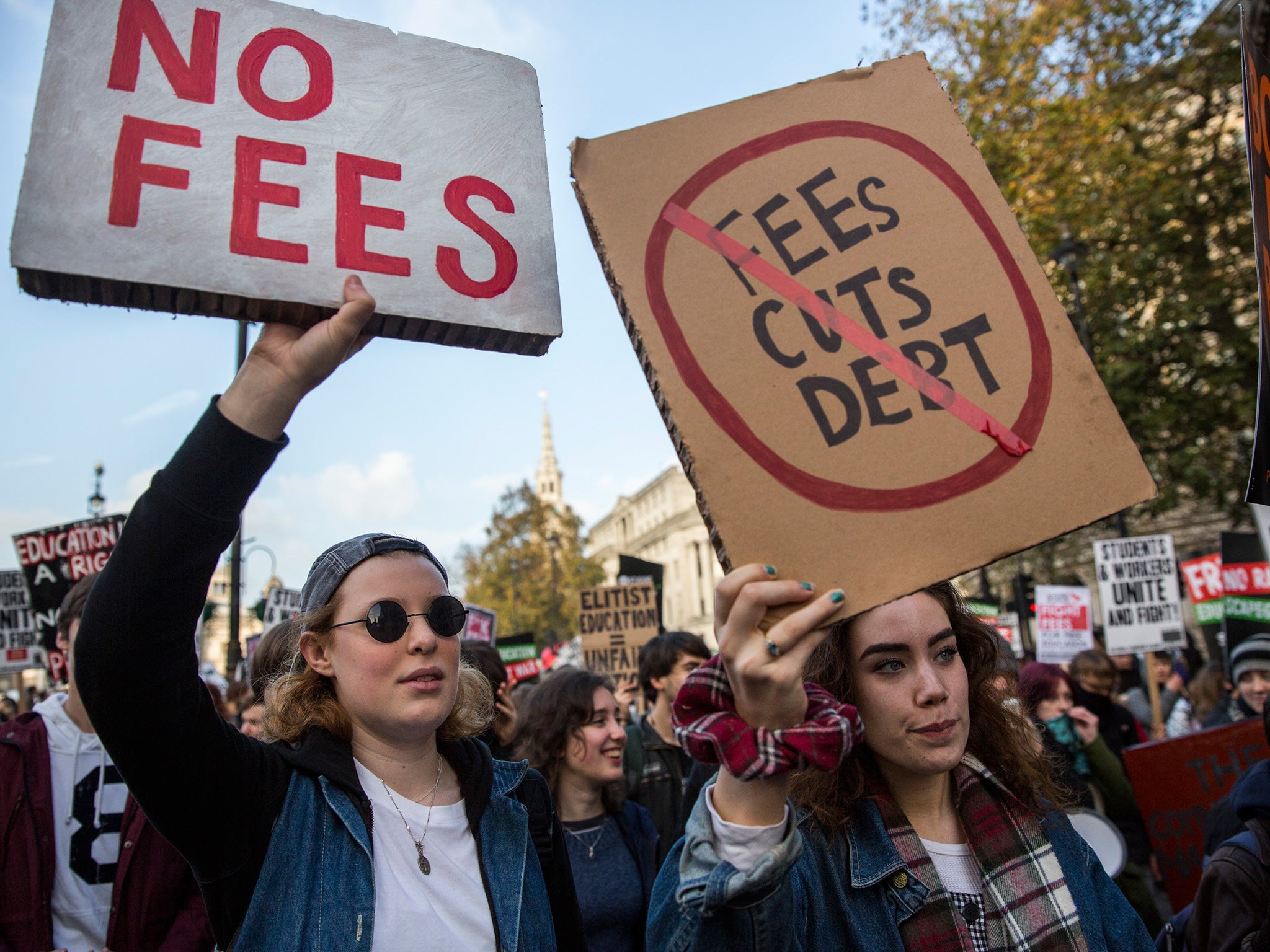 Protestors walk down The Strand during a march against student university fees on November 19, 2014 in London, England