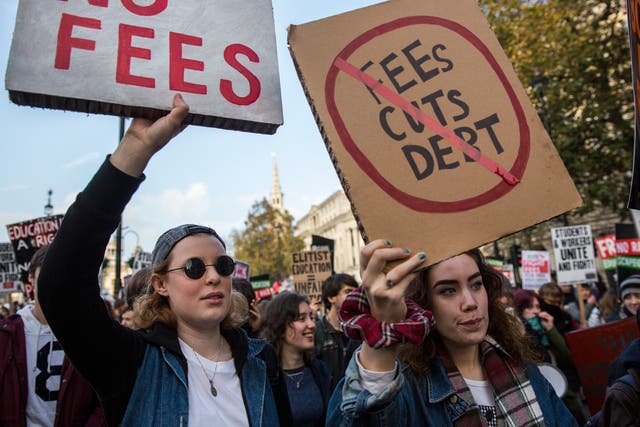 Protestors walk down The Strand during a march against student university fees on November 19, 2014 in London, England