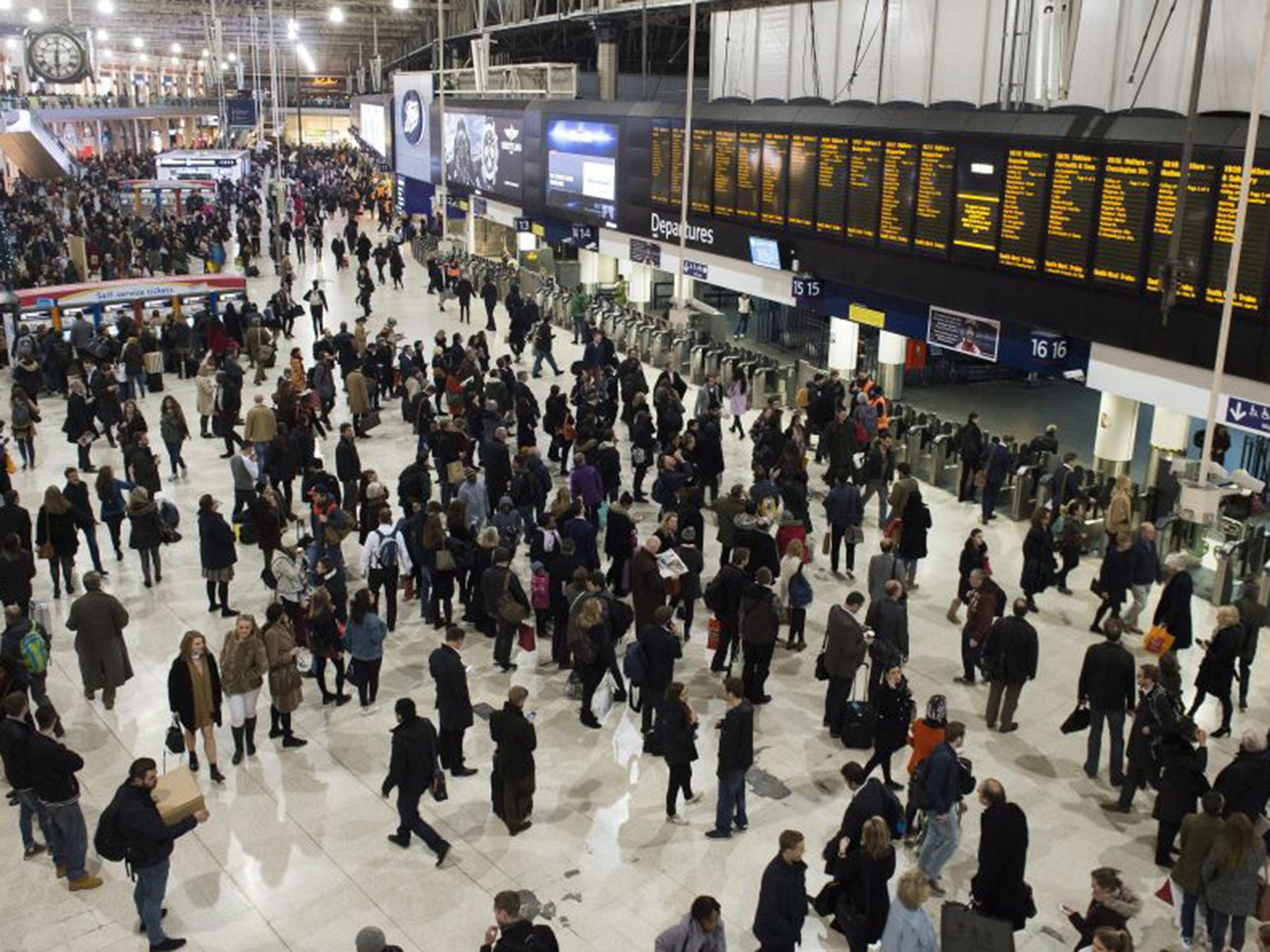 Commuters prepare to travel home for Christmas from London’s Waterloo