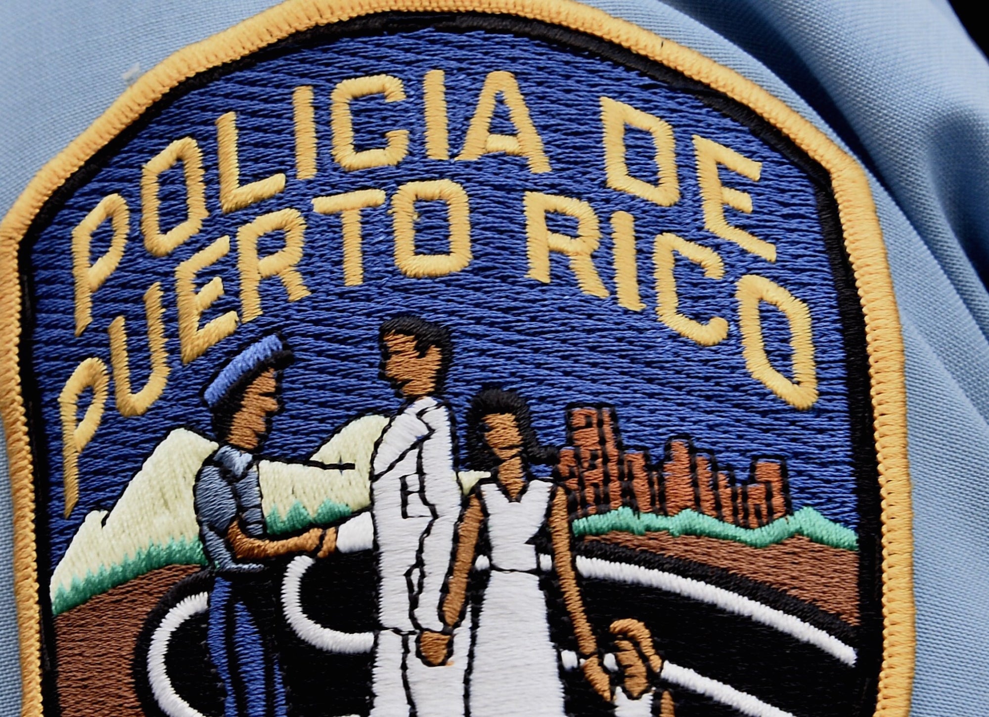 A police officer's shoulder patch is seen in the old town district in San Juan, Puerto Rico. AFP PHOTO / PAUL J. RICHARDS