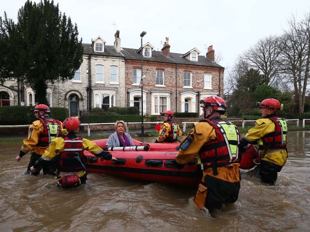 A woman in York is taken to safety in a dinghy