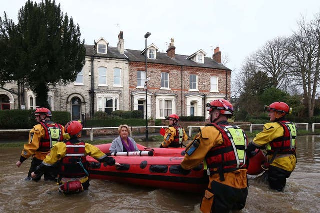 A woman in York is taken to safety in a dinghy