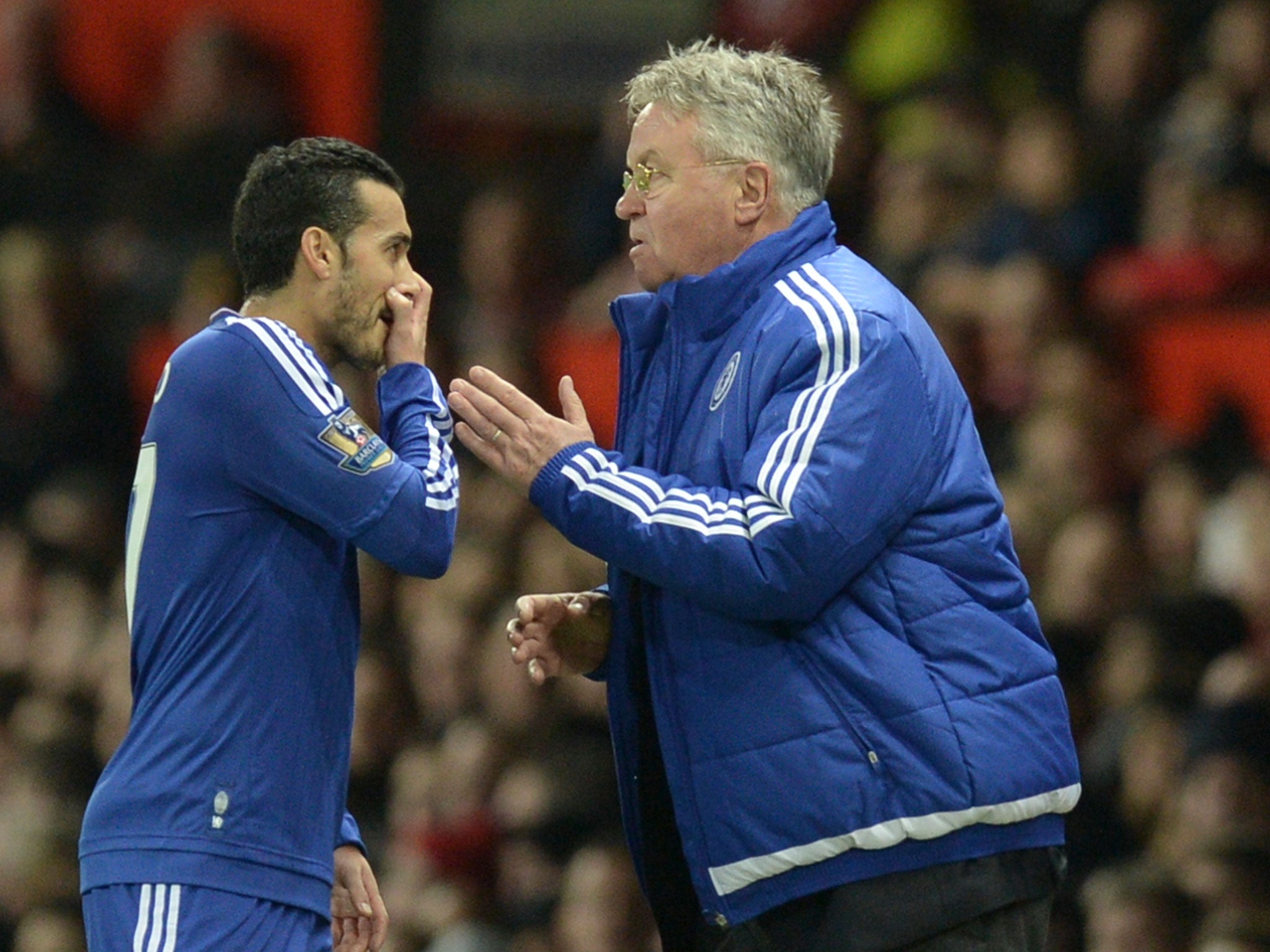 Pedro speaks with manager Guus Hiddink